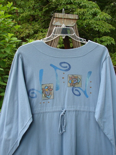 1997 Mask Jacket Windy Floral Peacock Size 1 with bell shape, special button closure, deep side pockets, and rounded swing hemline. Mid-weight cotton with floral theme and slightly raised draw cord back.