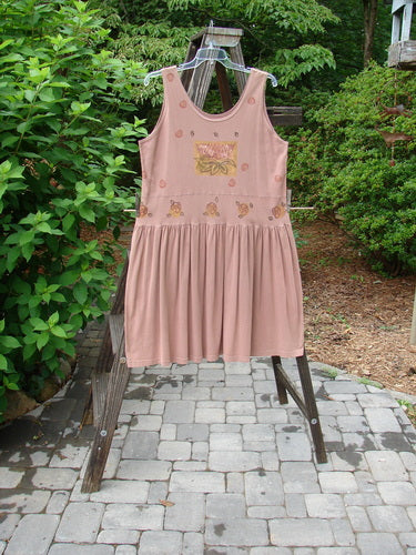 1993 Tier Dress Water Lilly Dried Rose Size 2: A dress on a rack, featuring a banded drop waistline, bottom flounce, and water lily theme paint.