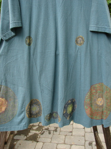 1993 Vagabond Dress Metallic Pinwheel Grey Green OSFA featuring a rolled V-shaped neckline, A-line shape with V inserts, and a large pinwheel design on medium weight cotton.