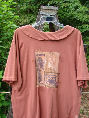 1994 Compass Top Mixed Terra Size 2 on a hanger, featuring an exaggerated elongated collar, vintage buttons, side vents, and garden creature theme paint from the Transitions Summer Collection.