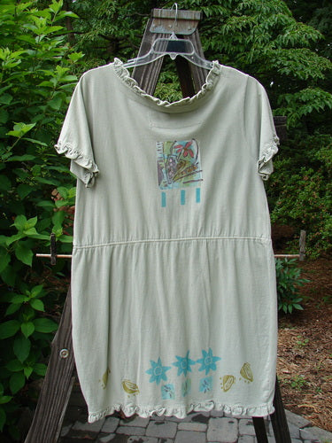 1991 Short Milkmaid Dress Sun Star Sage OSFA displayed on a mannequin, featuring a unique bell-shaped dropped waistband, laced neckline, and a distinctive beach-themed graphic design.
