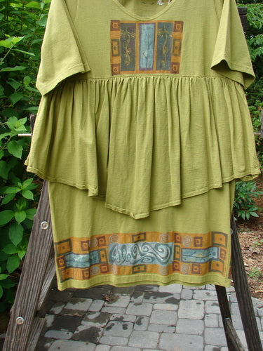 1993 NWT Picnic Dress Structural Olive OSFA displayed on a wooden ladder, featuring a gently rounded V neckline, flouncy hem, and vintage signature patch; perfect for summer outings.