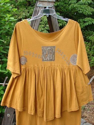 1993 Picnic Dress Windy Berries Oro OSFA displayed on a wooden clothes rack, showcasing a gently rounded V neckline and flouncy hem, part of Bluefishfinder's vintage collection.