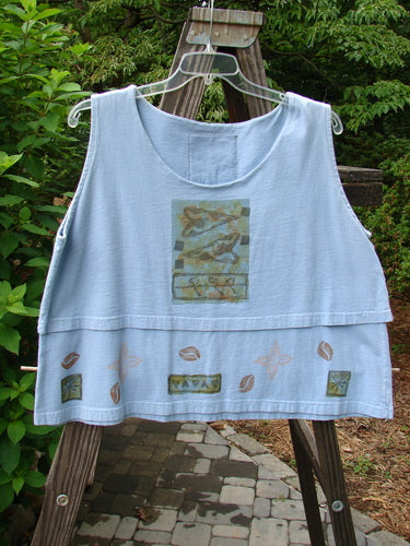 1993 Parallel Top Tiny Heart Sky OSFA displayed on a hanger, featuring a crop A-line cut, wide rounded neckline, double-layered bodice, and heart border design with Blue Fish patch on the back.