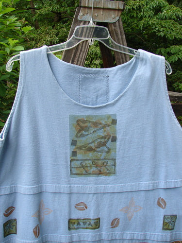 1993 Parallel Top Tiny Heart Sky OSFA: A blue tank top with a cropped A-line cut, wide rounded neckline, and tiny heart border theme. Features a Blue Fish patch at the center back.