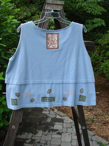 1993 Parallel Top Tiny Heart Sky OSFA displayed on a hanger, showcasing its crop A-line cut, double-layered bodice, wide rounded neckline, and central Blue Fish patch.