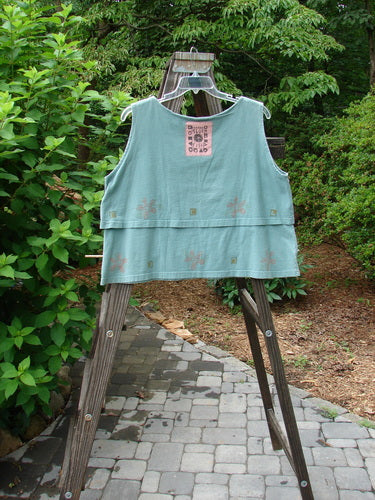 1993 Parallel Top Single Blossom Ocean OSFA: A blue shirt on a wooden stand with a wide and rounded neckline. Double-layered cotton with a crop A-line cut. Perfect condition.