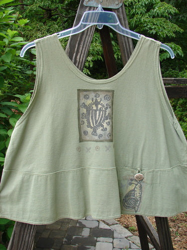 1995 Klee Top Single Beetle Time Marsh Size 1 displayed on a hanger, showcasing its swingy A-line crop shape with a scooped neckline, paneled hemline, and distinctive Blue Fish patch detailing.