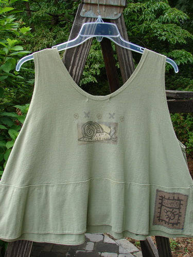 1995 Klee Top Single Beetle Time Marsh Size 1 displayed on a hanger, showcasing its swingy A-line crop shape, scooped neckline, and distinctive beetle garden theme paint with a ceramic button accent.