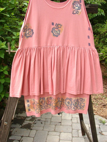 1992 Peplum Dress with floral border design on pink fabric. Features empire waistline, gathered lower, and hand-dyed silk ribbon. Vintage collectible in perfect condition.