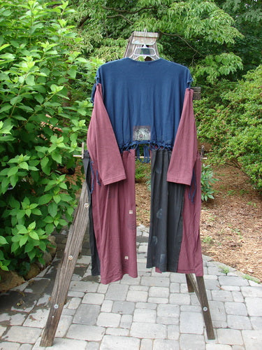 1997 Strapwork Jacket Vest Swirl City Multi OSFA displayed outdoors on a clothesline, showcasing unique design, double-layered cotton, removable sleeves, and stamped clay buttons.