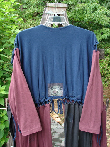 1997 Strapwork Jacket Vest Swirl City Multi OSFA displayed on a wooden hanger, showcasing its unique double-layered cotton design, removable sleeves, and detailed clay button accents.