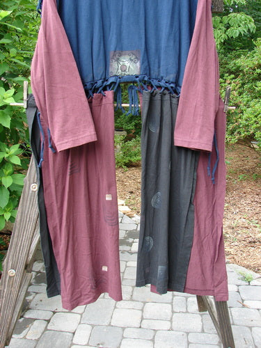 1997 Strapwork Jacket Vest Swirl City Multi OSFA displayed on a clothes rack, showcasing its unique design with removable sleeves, stamped clay buttons, and abundant swirl-themed paint accents.