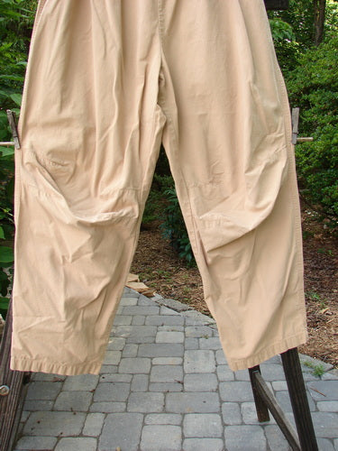 2000 Parachute Trekker Pant Unpainted Carmel Size 2 draped on a clothesline, highlighting the full elastic waistline, sturdy woven fabric, and additional knee fabric details.