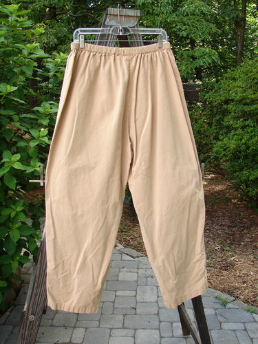 2000 Parachute Trekker Pant Unpainted Carmel Size 2, displayed hanging on a rope outdoors, showcasing its sturdy, medium-weight cotton fabric, full elastic waistline, and additional knee fabric.
