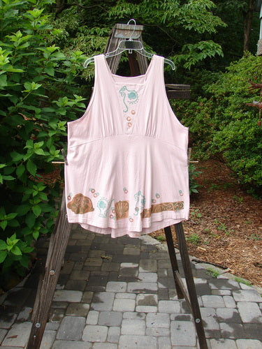 1993 Cha Cha Jumper Seashell Ash Pink OSFA on a rack, featuring a squared neckline, triangular insert, empire waist seam, gathered bust, hemline variation, rear grommets with thick cord pull, and seashell swirl prints.