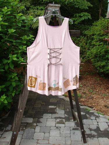 1993 Cha Cha Jumper: Ash Pink cotton shirt with lace-up back. A-line flare, gathered bust, and seashell and swirl block prints. OSFA.