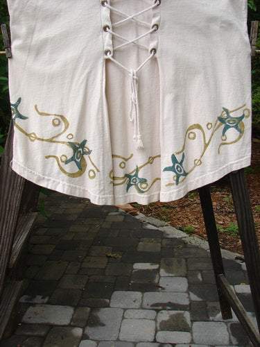 1993 Cha Cha Jumper Starfish Teadye OSFA: A white skirt with gold designs, featuring a squared neckline, empire waist, and gathered bust, with blue fish patch and starfish swirl prints.