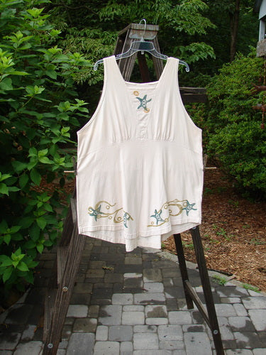 1993 Cha Cha Jumper Starfish Teadye OSFA displayed on a hanger, featuring a squared-off neckline, A-line flare, varying hemline, rear metal grommets with cord pull, and starfish block prints.