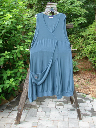 Barclay Patched Thermal Traverse Jumper Teal Size 2 displayed on a clothes rack, showcasing unique textures, sectional accents, and a floppy pocket for a detailed, vintage-inspired look.