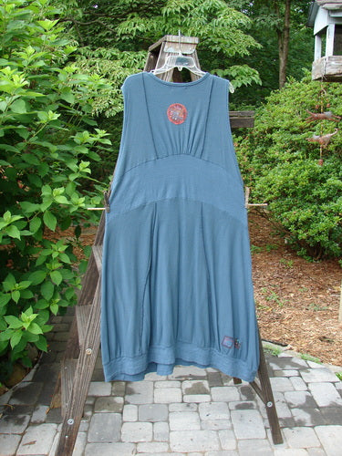 Barclay Patched Thermal Traverse Jumper Teal Size 2 displayed on a clothes rack, showcasing textured accents, diagonal lines, and a unique S-shaped design.