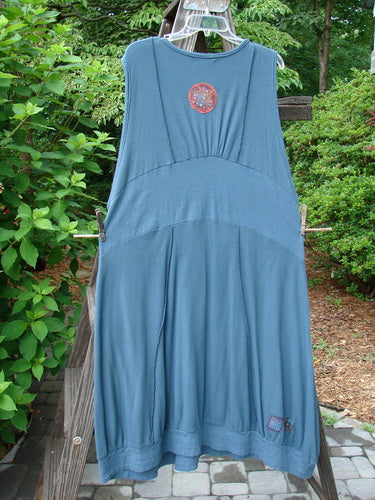 Barclay Patched Thermal Traverse Jumper Teal Size 2 hanging on a clothesline, showcasing sectional accents, exterior seams, and a drop pocket with mixed textures and lines.