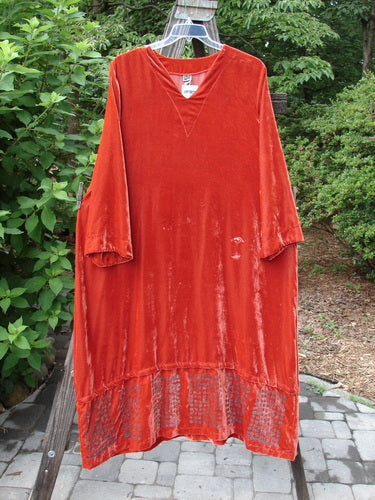 2000 NWT Silk Velvet Templeisen Gown Starlight Sienna Size 1 draped on a wooden rail, showcasing its superior flow and unique snap-on snap-off hemline, belled sleeves, and V-shaped neckline.