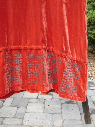 2000 NWT Silk Velvet Templeisen Gown Starlight Sienna Size 1 on display, showcasing its luxurious texture, unique snap-on hemline, V-shaped neckline, and belled sleeves.