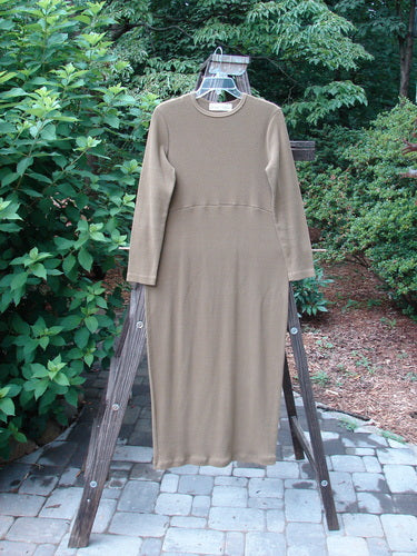 1998 Pebble Dress Unpainted Leaf Size 1 displayed on a rack, showcasing its ribbed material, pegged bottom, and slightly narrowing lower sleeves.