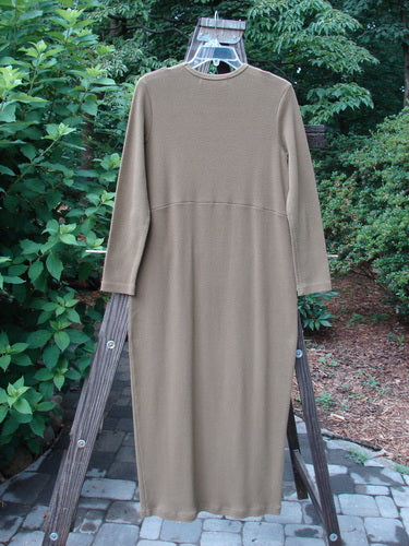 1998 Pebble Dress Unpainted Leaf Size 1 on a rack, showcasing long sleeves, downward yoked waist seam, and a pegged bottom, made from thick, stretchy ribbed cotton Lycra.