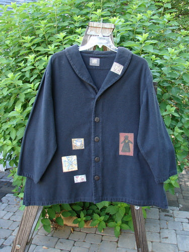 1999 Patched Flannel PJ Top Paper Doll Black Size 1: Blue jacket with multiple patches, thick flannel fabric, drop shoulders, vented sides, A-line shape, fold-over collar, and large rounded buttons.