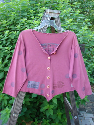 1994 Curve Shirt Studio Umeboshi Size 1 displayed on a swing, featuring a V-shaped neckline, varying hemline, original buttons, and classic art studio theme paint.