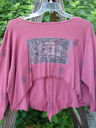 1994 Curve Shirt Studio Umeboshi Size 1, featuring a graphic design, V-shaped neckline, and unique hemline, displayed on a hanger.
