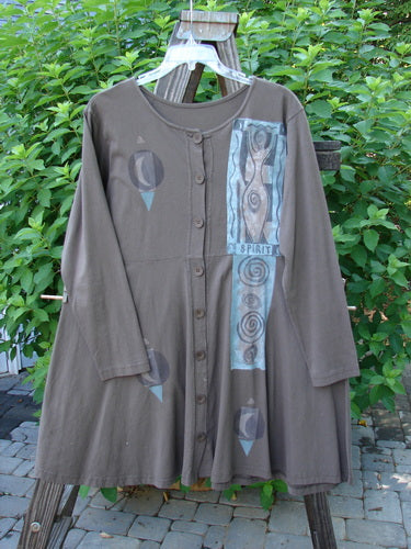 1994 Poppy Dress Collarless Figure Eight Woman Humus Size 2: Vintage brown dress with empire waist, full sweeping lower, 8 vintage buttons, rolled collar, and signature blue fish patch.