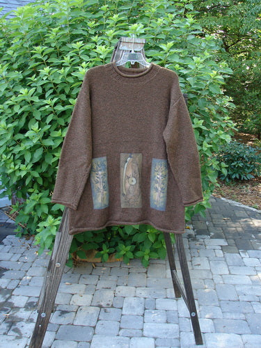 1998 Alpaca Patched Simple Tunic Sweater Mixed Forest Tweed OSFA displayed on a hanger, showcasing its ribbed mock collar, oversized nature-themed patches, dropped shoulders, and varying hemline.