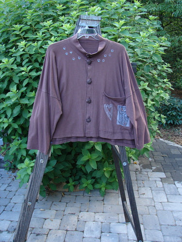 1996 Elements Mock T Neck Jacket Heart Spicewood OSFA: A swingy brown jacket with a front pocket, double-buttoned mock neckline, and colorful heart theme paint.