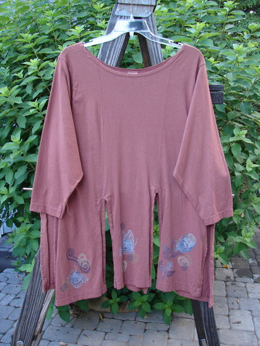 1994 Windmill Top Butterfly Clay Size 1: Long-sleeved, free-flowing top with a repetitive butterfly theme, sectioned panels, and a wider neckline, displayed hanging outdoors.