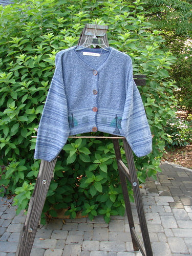 1994 Crop Cardigan Sweater Wine Bottle Haiku Blue OSFA displayed on a wooden ladder showcasing its unique design, stoneware buttons, and cozy longer sleeves.