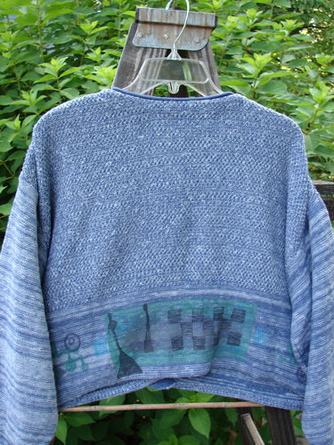 1994 Crop Cardigan Sweater Wine Bottle Haiku Blue OSFA displayed on a hanger, showcasing its cozy longer sleeves, V-shaped neckline, and unique stoneware buttons, emphasizing the intricate knit textures and detailed craftsmanship.