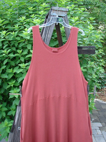 Barclay Thermal Teapot Jumper Unpainted Pomme Size 1 displayed on a wooden pole, showcasing deep side pockets and a unique belled hemline with a cozy ribbed thermal waffle fabric.