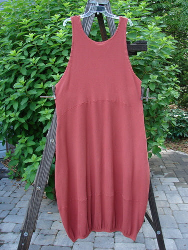 Barclay Thermal Teapot Jumper Unpainted Pomme Size 1 displayed on a wooden rack, showcasing cozy ribbed thermal waffle fabric, deep side pockets, pegged hem circumference panel, and deep arm openings.