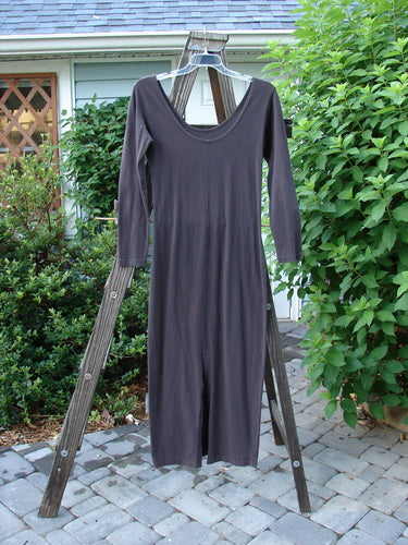 A 1992 Cotton Lycra Back Vent Dress in Black Sand, Size 2. Hourglass shape, rear kick vent, V front and rear neckline, pegged hemline. Perfect for layering.