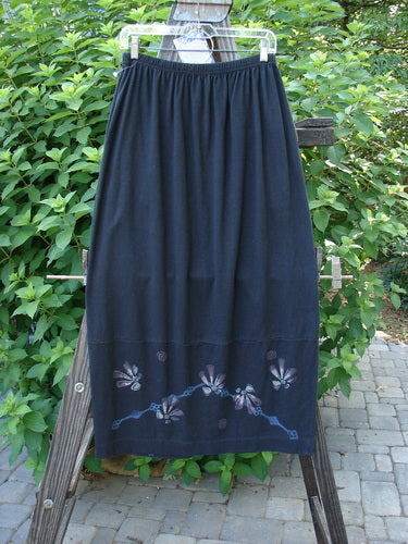 1997 NWT Indra Skirt Abstract Floral Obsidian Size 1 displayed on a rack, featuring a full elastic waistline, double paneled lower, mismatched colorful buttons, and superior vents with loop closures.