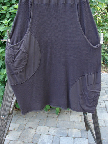 Barclay Thermal Celtic Moss Panel Pocket Circle Skirt Unpainted Darker Bark Size 2 hanging on a clothesline, showcasing deep upper pockets and a full elastic waistband.