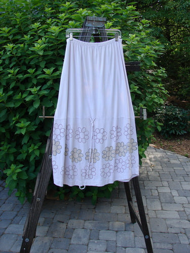Barclay Spring Shade Skirt Circle Center Pale Pink Size 2 displayed on a rack, showcasing its full elastic waistband, scooped hemline, extra-long cord, and sectional horizontal panels.