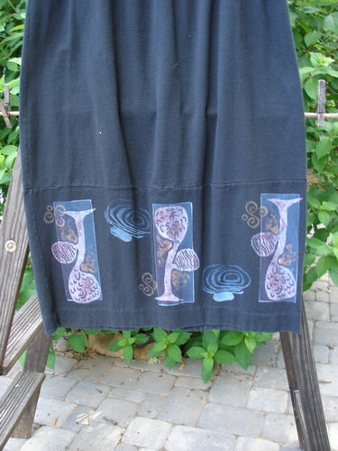 1997 Indra Skirt Whimsical Forest Obsidian Size 1, featuring a full elastic waistline, double paneled lower, colorful chiseled buttons, deep side pockets, and superior vents with sweet loop closures.