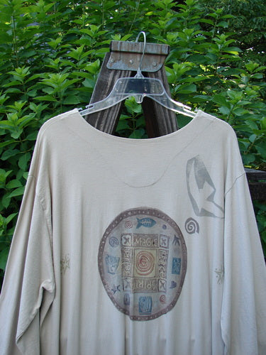 1994 Column Dress Belief Mist Size 1 displayed on a hanger, featuring a full front button design, V-shaped neckline, longer sleeves, and a flounce hem, reflecting vintage Blue Fish Clothing’s creative ethos.