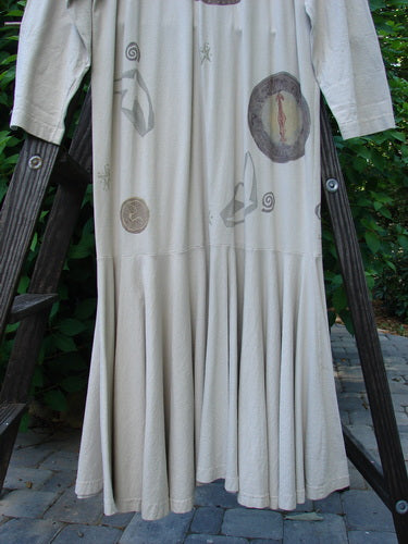 1994 Column Dress Belief Mist Size 1: A long white dress on a wooden ladder. Full button duster shape with elongating paint. Flounce bottom and V-shaped neckline. Longer sleeves and U-shaped upper shoulder seam.