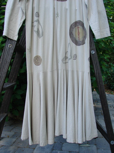 1994 Column Dress Belief Mist Size 1 displayed on a wooden ladder, showcasing its full front button design, V-shaped neckline, and abundant elongating paint. A vintage piece from Bluefishfinder.com.