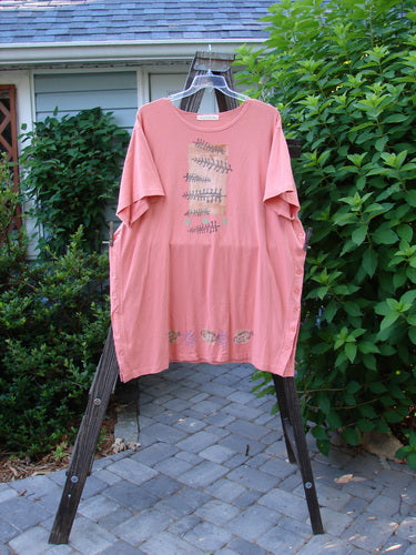 1997 Mauritius Top Fern Fish Tangerine OSFA displayed on a clothes rack, showcasing original floral buttons, tall side vents, and a wider, longer square cut with a slight lower bell shape.